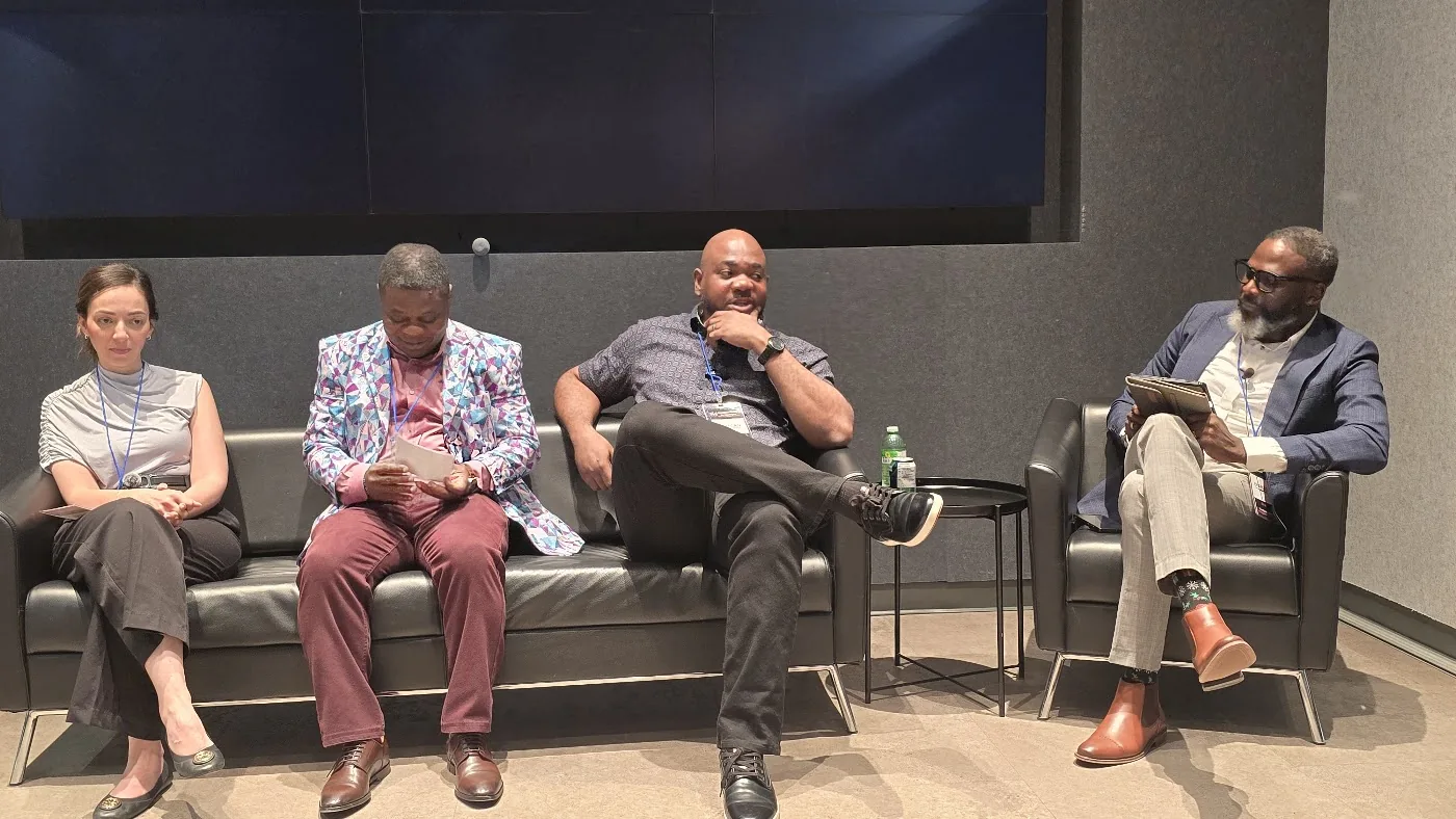 Panel contributors seated during the July CI3 forum